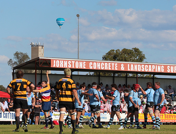 Blue Boars at the Grand Final in Narrabri. Santos hot air balloon in background.